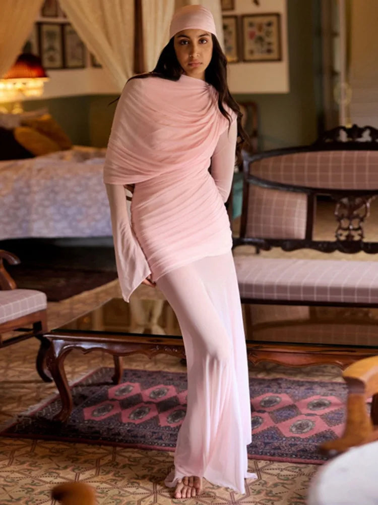 Ruched pink maxi dress styled for an elegant evening party