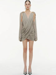 Detail of the ruched drape through the waist and hips, creating flattering contouring and elegant texture in a slim mini silhouette.