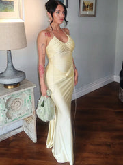 Ruched yellow halter evening gown with lace-up back design
