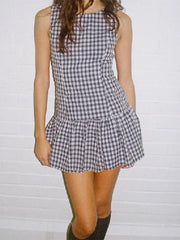 Ruffle detail blue and white summer dress shown on model