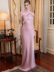 A woman wearing a satin backless maxi dress.