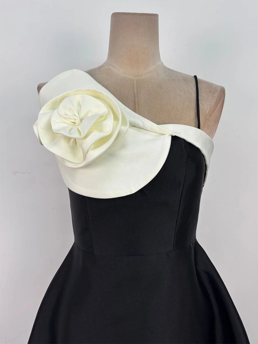 Black formal midi dress with an artistic flower neckline design