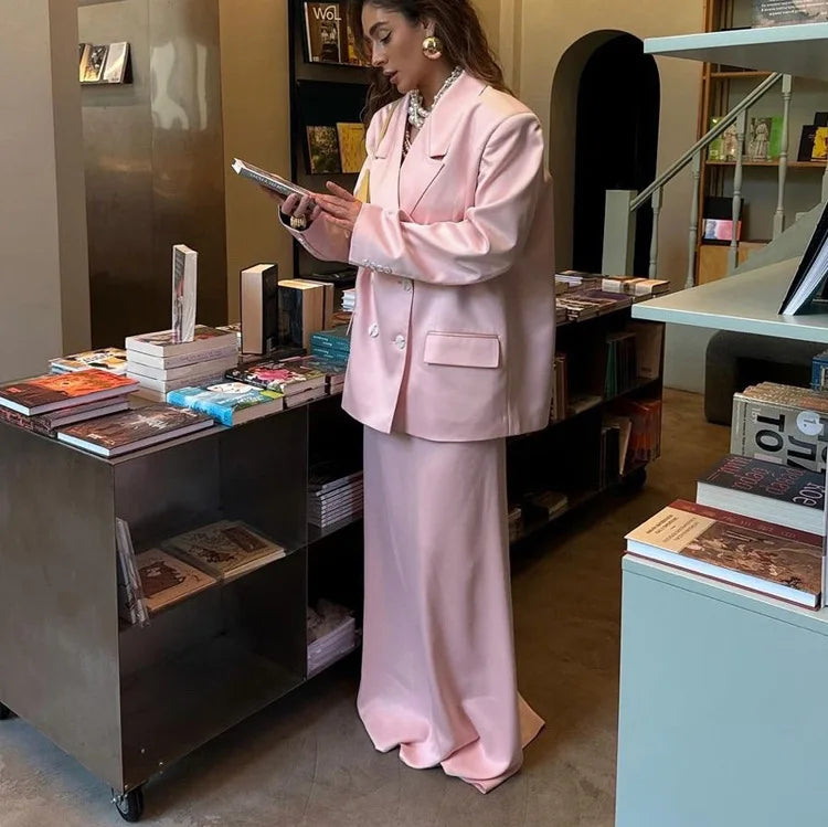 A close-up of the satin fabric and button detail on the blazer.