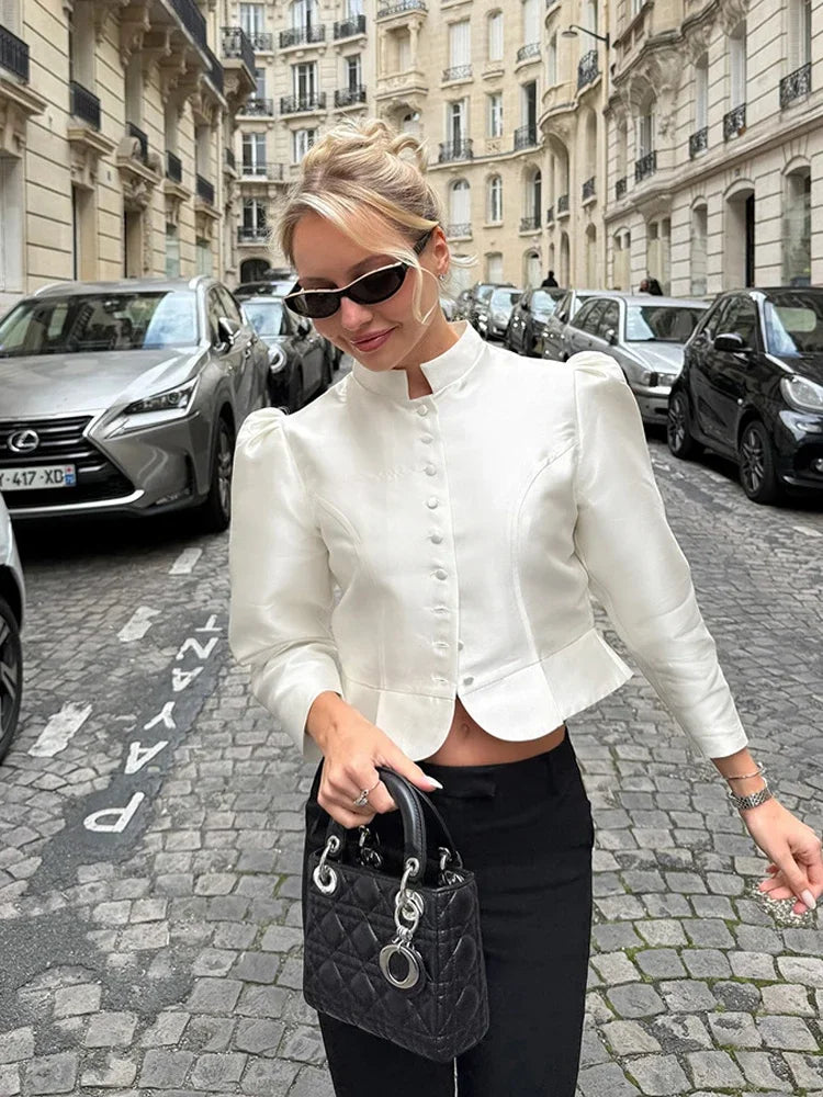 Close view of the collar and fabric texture on a cropped jacket top