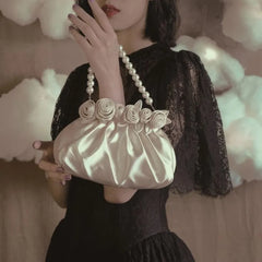 Soft shell vintage-inspired handbag in beige with floral details