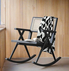 Scandinavian-inspired wooden rocking chair with rattan seat
