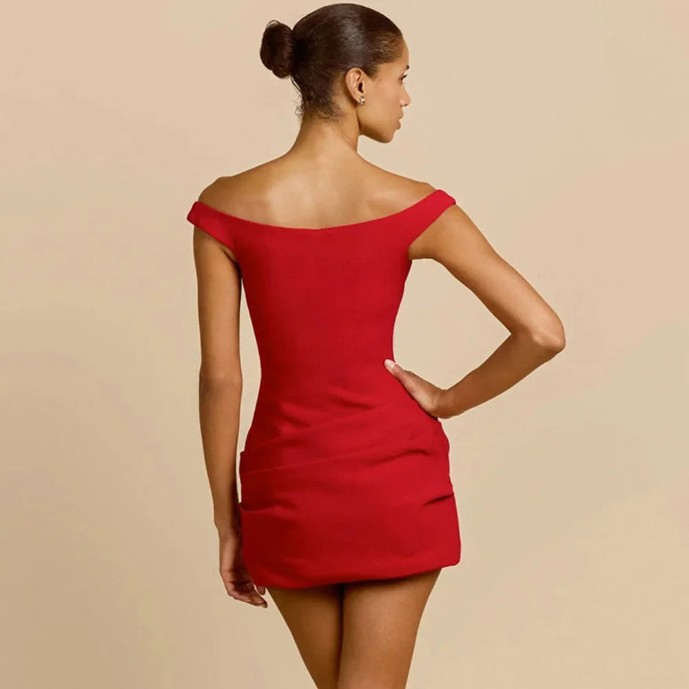 Three-quarter pose showing the sculpted mini silhouette and neckline frame, styled for a clean, photo-ready night-out look.