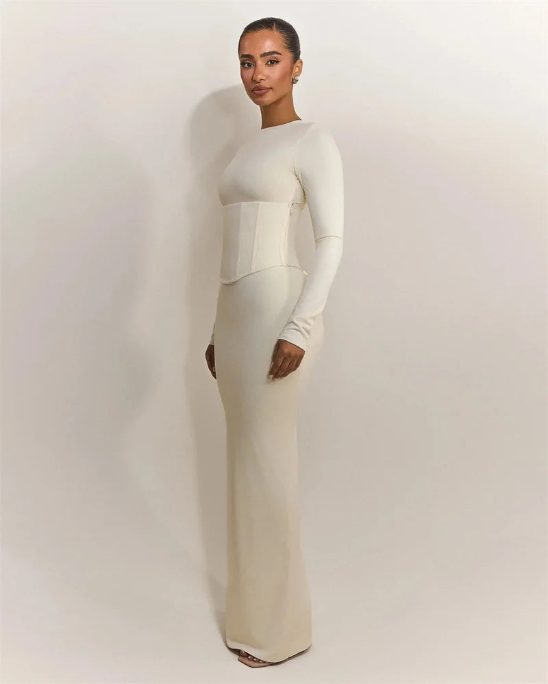 Angled view showing the refined long sleeve design and sleek, minimalist evening profile.