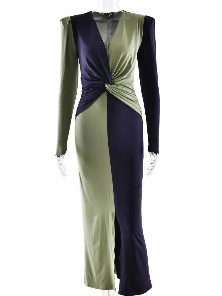 Full-length styling of a slim two-tone maxi dress with long sleeves and refined walkability.