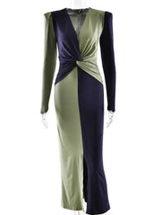 Full-length styling of a slim two-tone maxi dress with long sleeves and refined walkability.