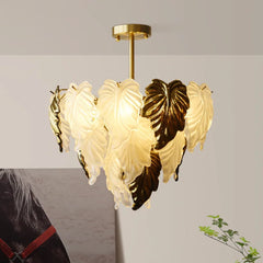 Sculptural flush mount gold chandelier casting soft ambient glow