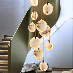 Sculptural LED pendant lighting a modern stairwell