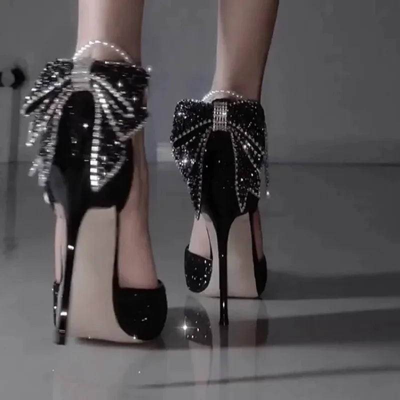 “Sequin bow high heel shoes with pointed toe and pearl trim”

