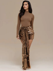 Full-length view of brown top paired with gold draped sequin mini skirt