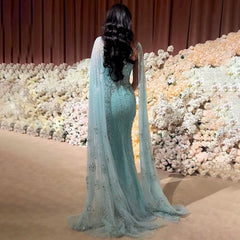 The sequin-embellished wedding party gown is styled for a formal event.