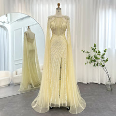 A full shot of the sequined evening gown showing the mermaid silhouette and sweep train.