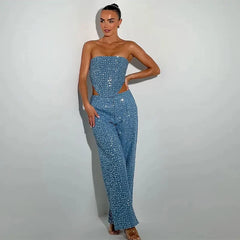 Woman wearing strapless sequined corset with wide-leg denim pants