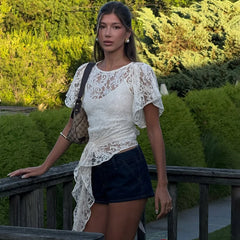 A close-up shot of the delicate lace and ribbon details on the top.