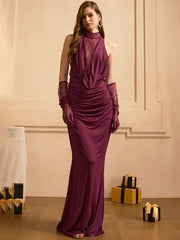 Model wearing a high-neck sheer lace maxi dress with ruched draping through the waist, styled for an elegant evening look.