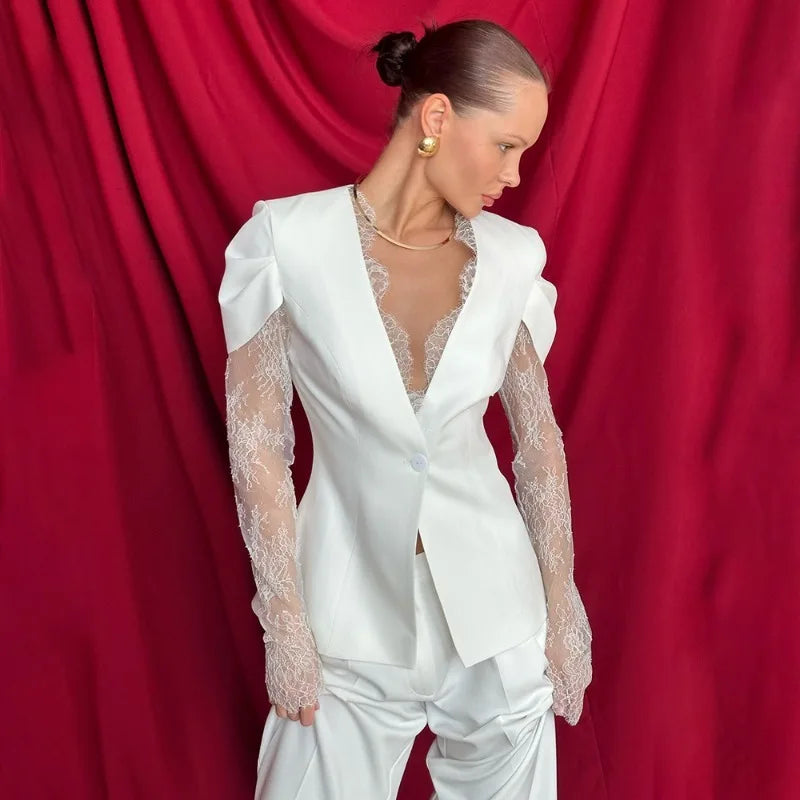 Close view of sheer lace patchwork on long sleeve blazer