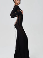 Sheer mesh batwing sleeve party maxi dress with sheer panels on a white background.
