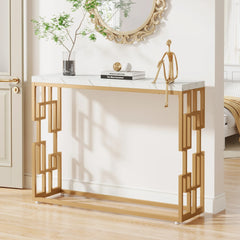 “Side view of minimalist gold frame console behind sofa setup”


