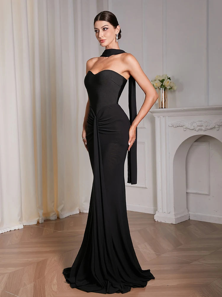 Elegant black draped maxi dress with ankle length hem and patchwork detail
