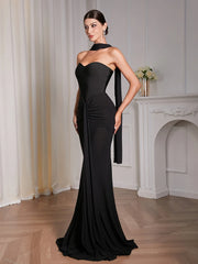 Elegant black draped maxi dress with ankle length hem and patchwork detail