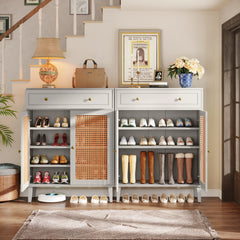 “Side view of slim gray entryway cabinet with decor accents on top”

