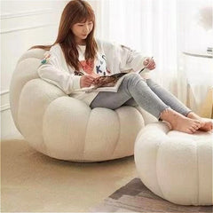 side angle view of pumpkin-style lazy sofa on wooden flooring

