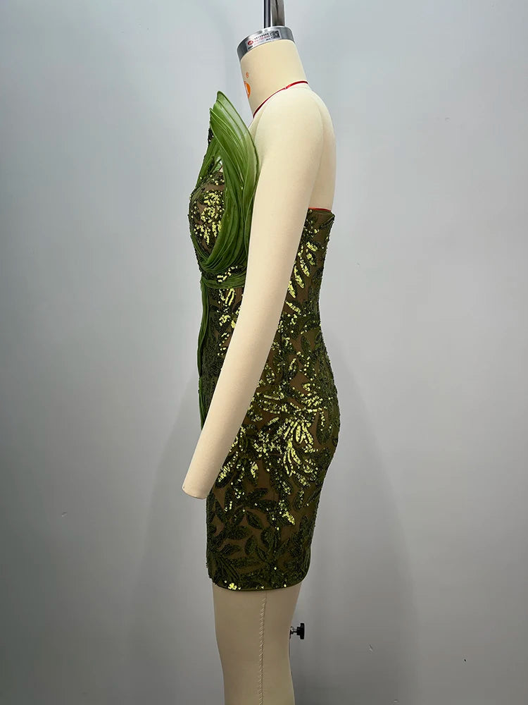 Side view - structured evening mini gown in green for parties on a mannequin against a grey background