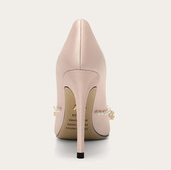 Close-up of silk beaded pointed-toe stiletto shoes