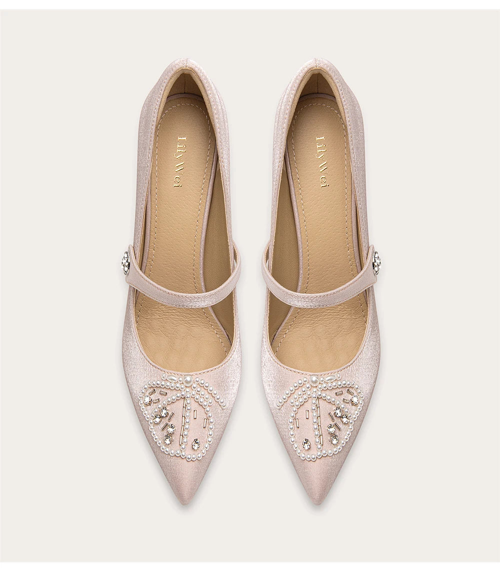 a silk pump with pearls, rhinestones, and a thin heel.