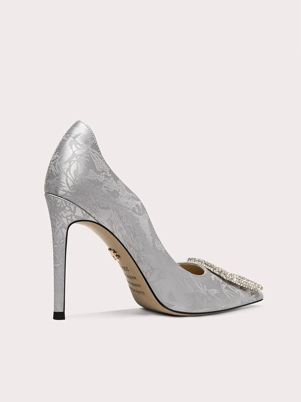 Close-up of silk print pumps with square crystal buckle
