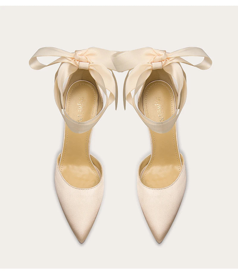 a silk pump with a ribbon-bow design and a thin heel.