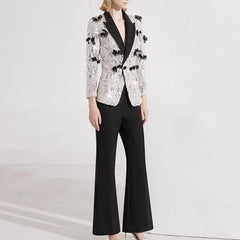 Slim silver blazer paired with ankle-length pants