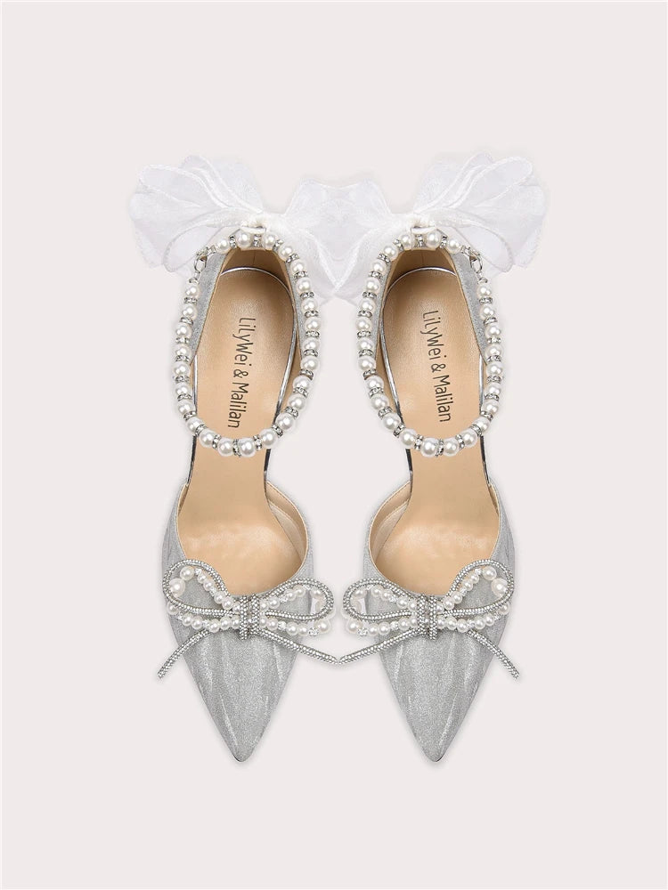 Silver pearl bow party sandals styled for weddings and glamour events