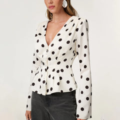 A full-length shot of a single-breasted fashion female top styled for a casual day out.