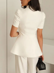 Single-breasted white peplum top featuring statement puff sleeves