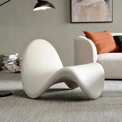 Single-seater lounge chair styled in a minimal room