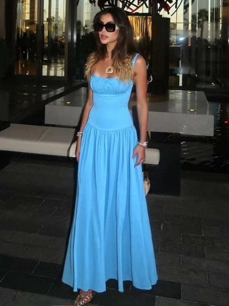 Sky blue spaghetti strap maxi dress styled for a breezy summer day