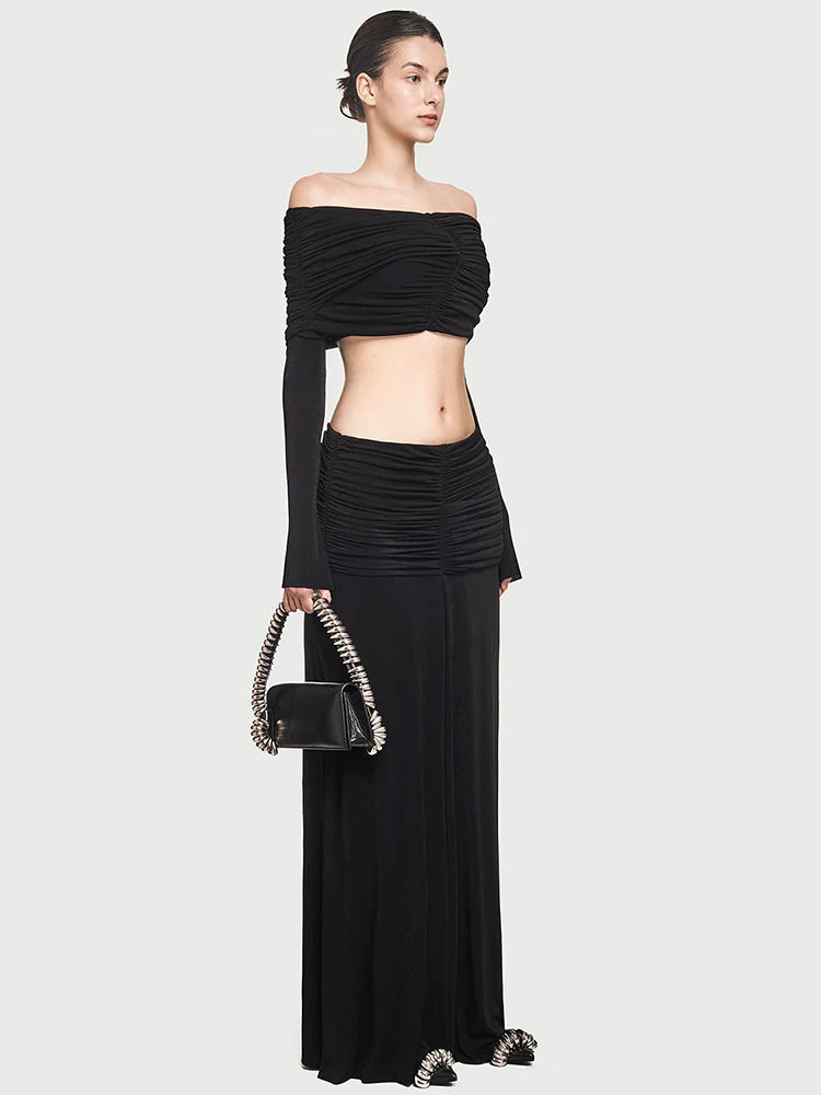 Off-shoulder slash-neck long sleeve top paired with an ankle-length skirt
