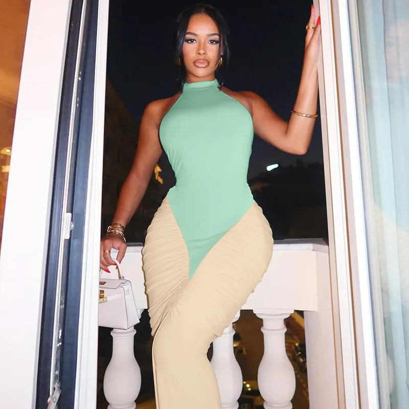 A full-length shot of a sleeveless contrast color club dress, highlighting its silhouette.