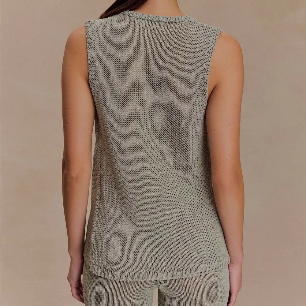 Sleeveless gray knit top shown as a closet staple for chic outfits