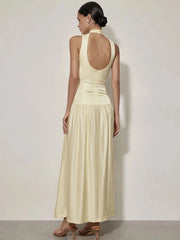 Solid yellow long dress with high neckline and flowing hem