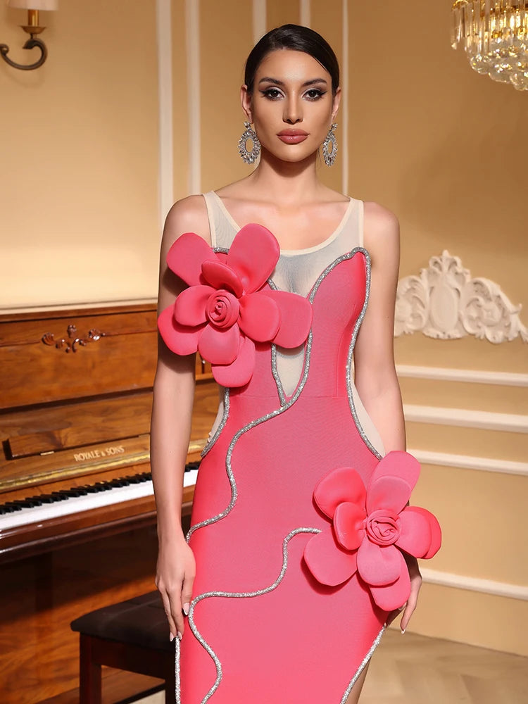 Woman wearing a sleeveless sheath party dress in pink with unique 3D flower detail in an elegant indoor setting