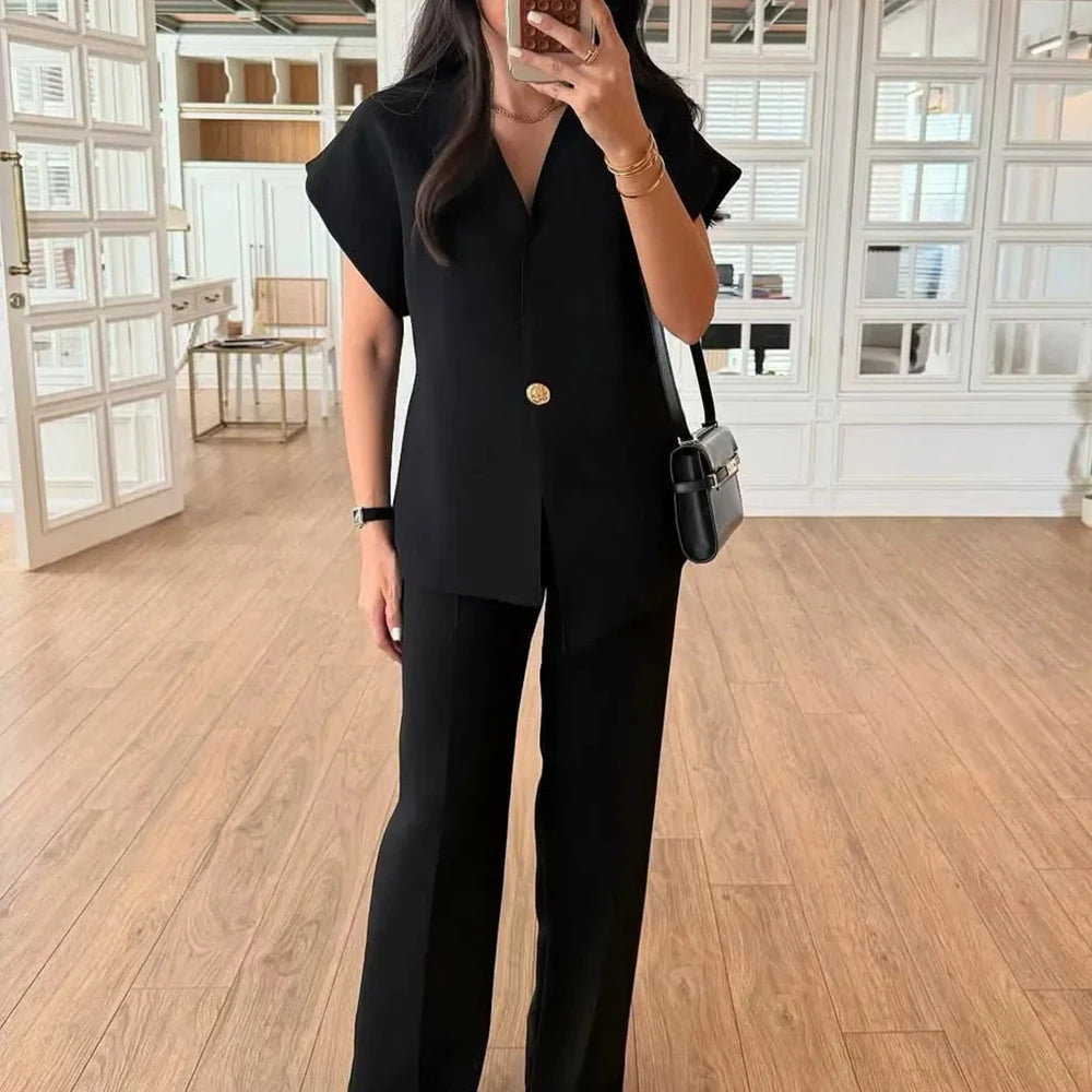 Minimalist women’s vest and pant outfit styled for modern workwear