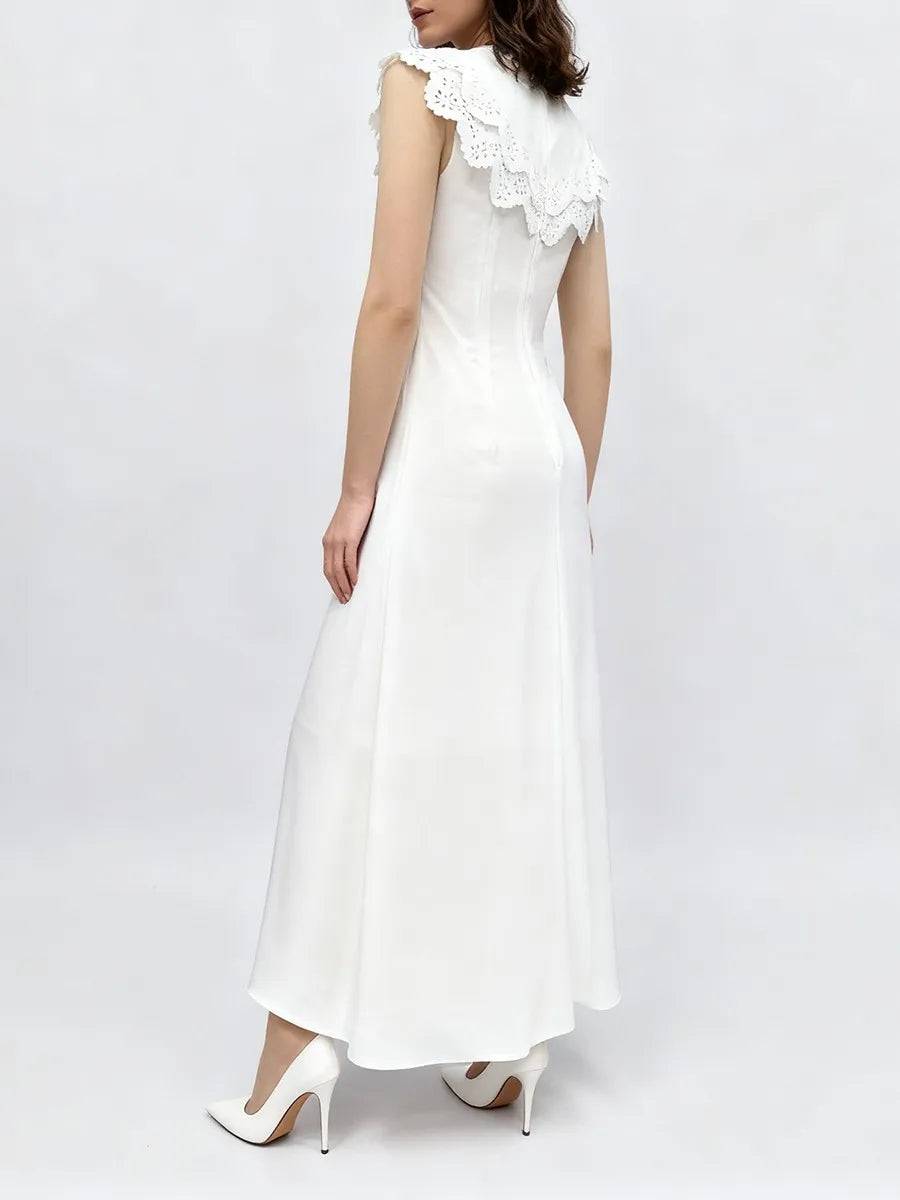 Side profile of a white midi dress with an empire waistline.