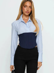 Slim blue bandage waist shirt styled with black trousers
