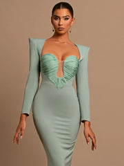 The slim fit of the dress, highlighting its flattering silhouette.